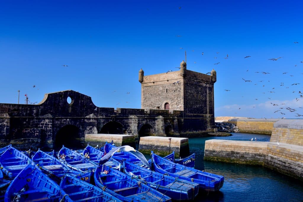 Essaouira fishing port and blue boats Morocco